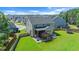 Backyard with a screened deck, stairs, concrete patio, and fenced-in yard perfect for outdoor entertaining at 232 Randleman Ct, Holly Springs, NC 27540
