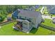An aerial view of the home's backyard featuring a wooden deck and lush green lawn at 232 Randleman Ct, Holly Springs, NC 27540