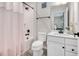 Cozy bathroom with a shower, tub, toilet, vanity, and quartz counters at 232 Randleman Ct, Holly Springs, NC 27540