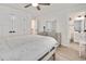 Bedroom featuring a comfortable bed, dresser, and a view into a bathroom at 232 Randleman Ct, Holly Springs, NC 27540