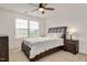Cozy bedroom with ceiling fan, natural light, and neutral colors for a serene atmosphere at 232 Randleman Ct, Holly Springs, NC 27540