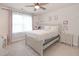 Bright bedroom with a ceiling fan, and side table at 232 Randleman Ct, Holly Springs, NC 27540