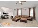 Spacious living area with comfortable seating, a ceiling fan, and natural light at 232 Randleman Ct, Holly Springs, NC 27540