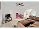 Comfortable living room with ceiling fan and entertainment setup, offering ample space for relaxation at 232 Randleman Ct, Holly Springs, NC 27540