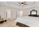 Spacious main bedroom featuring a trey ceiling and access to the en suite bathroom at 232 Randleman Ct, Holly Springs, NC 27540