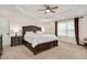 Luxurious main bedroom with tray ceiling, elegant furnishings, and abundant natural light at 232 Randleman Ct, Holly Springs, NC 27540