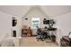 Bright and functional office space with ample lighting and desk setup, perfect for productivity at 232 Randleman Ct, Holly Springs, NC 27540