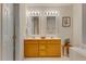 Bathroom showcasing a double vanity and contemporary lighting fixtures at 244 Sweet Bay Pl, Carrboro, NC 27510