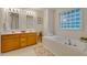 Bathroom features a double vanity and a luxurious soaking tub at 244 Sweet Bay Pl, Carrboro, NC 27510