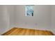 Bedroom featuring hardwood floors and a small window allowing natural light at 244 Sweet Bay Pl, Carrboro, NC 27510