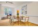 Elegant dining room with hardwood floors and view into the kitchen at 244 Sweet Bay Pl, Carrboro, NC 27510