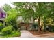 Home with a garage, upper-level stairs, driveway, and a yard filled with trees at 244 Sweet Bay Pl, Carrboro, NC 27510