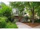 Exterior shot of a multi-story home surrounded by trees and greenery at 244 Sweet Bay Pl, Carrboro, NC 27510