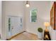 Bright foyer with hardwood floors, front door, and view of the front porch at 244 Sweet Bay Pl, Carrboro, NC 27510