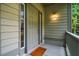 Charming front entrance with light-grey door and a decorative welcome mat at 244 Sweet Bay Pl, Carrboro, NC 27510