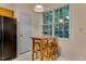 Eat-in kitchen with a wooden table and chairs in front of a large window at 244 Sweet Bay Pl, Carrboro, NC 27510