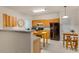 This open kitchen boasts an island, wooden cabinets, and stainless steel appliances at 244 Sweet Bay Pl, Carrboro, NC 27510