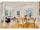 Bright living room with hardwood floors, large windows, and comfortable seating area at 244 Sweet Bay Pl, Carrboro, NC 27510