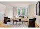 Stylish living room with bay windows, comfortable seating, and decorative accents at 244 Sweet Bay Pl, Carrboro, NC 27510