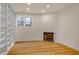 Cozy living room with hardwood floors, a fireplace, and built-in bookshelves at 244 Sweet Bay Pl, Carrboro, NC 27510
