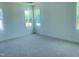 A bedroom features ample natural light and neutral-toned carpet at 28 Carteret Ct, Clayton, NC 27527