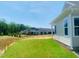 Exterior of the home showing the manicured lawn and surrounding trees at 28 Carteret Ct, Clayton, NC 27527