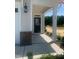 Entrance view of the home's covered front door, with brick accents, and house number at 28 Carteret Ct, Clayton, NC 27527