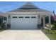 View of the home's garage and driveway at 28 Carteret Ct, Clayton, NC 27527
