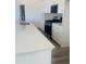 A well-lit kitchen boasts an island, stainless steel appliances, and white cabinetry at 28 Carteret Ct, Clayton, NC 27527