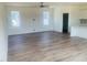 Open concept living room and kitchen with wood floors and large windows at 28 Carteret Ct, Clayton, NC 27527