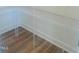 Walk-in pantry with shelving and hardwood floors at 28 Carteret Ct, Clayton, NC 27527