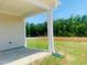 Covered patio featuring a concrete floor and white support beams at 28 Carteret Ct, Clayton, NC 27527