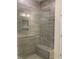 Walk-in shower with a bench and a glass door at 28 Carteret Ct, Clayton, NC 27527