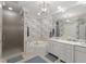 Luxurious bathroom with a soaking tub, separate shower, and dual vanity with white countertops at 2813 Market Bridge Ln # 104, Raleigh, NC 27608