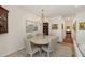 Elegant dining room features a round table with seating for six and classic chandelier lighting at 2813 Market Bridge Ln # 104, Raleigh, NC 27608
