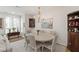 Bright dining room offers a round table, seating for six, and a charming china cabinet at 2813 Market Bridge Ln # 104, Raleigh, NC 27608
