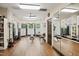 Spacious gym area with wood floors, weight training equipment, and natural light at 2813 Market Bridge Ln # 104, Raleigh, NC 27608