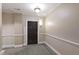 Well lit hallway with carpet, and a door leading to unit 103 at 2813 Market Bridge Ln # 104, Raleigh, NC 27608