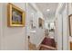 Inviting hallway offers views into the kitchen and living room, plus classic artwork at 2813 Market Bridge Ln # 104, Raleigh, NC 27608
