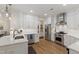 Updated kitchen with stainless steel appliances, white cabinets, and ample counter space at 2813 Market Bridge Ln # 104, Raleigh, NC 27608