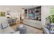 Open-concept living area showcases custom built-ins and seamless flow into the adjacent, modern kitchen at 2813 Market Bridge Ln # 104, Raleigh, NC 27608