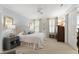 Serene main bedroom with plush carpeting, neutral tones, and plantation shutters for privacy at 2813 Market Bridge Ln # 104, Raleigh, NC 27608