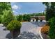 Beautiful view of the parking and entrance with vibrant flower beds and lush greenery at 2813 Market Bridge Ln # 104, Raleigh, NC 27608