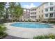 Inviting community pool surrounded by well-maintained landscaping and upscale residential buildings at 2813 Market Bridge Ln # 104, Raleigh, NC 27608