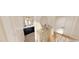 Bathroom featuring dark-blue vanity with white countertop, gold mirror, and white doors in neutral color scheme at 2940 C Chapel Hill Road, Durham, NC 27707