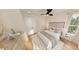 Bedroom featuring a bed with stylish rug, complemented by natural light from the window and wood floors at 2940 C Chapel Hill Road, Durham, NC 27707