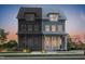 Charming two-story home featuring a covered porch and a combination of painted and unfinished wood siding at 2940 C Chapel Hill Road, Durham, NC 27707