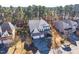 Bird's eye view of a traditional home with three-car garage surrounded by trees and community landscape at 309 Malvern Hill Ln, Morrisville, NC 27560