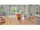 Bright breakfast nook with bench seating, a round table, and a large window overlooking the trees at 314 Chanticlair Dr, Apex, NC 27502