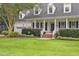 Two story home with a covered front porch and attached two car garage at 314 Chanticlair Dr, Apex, NC 27502